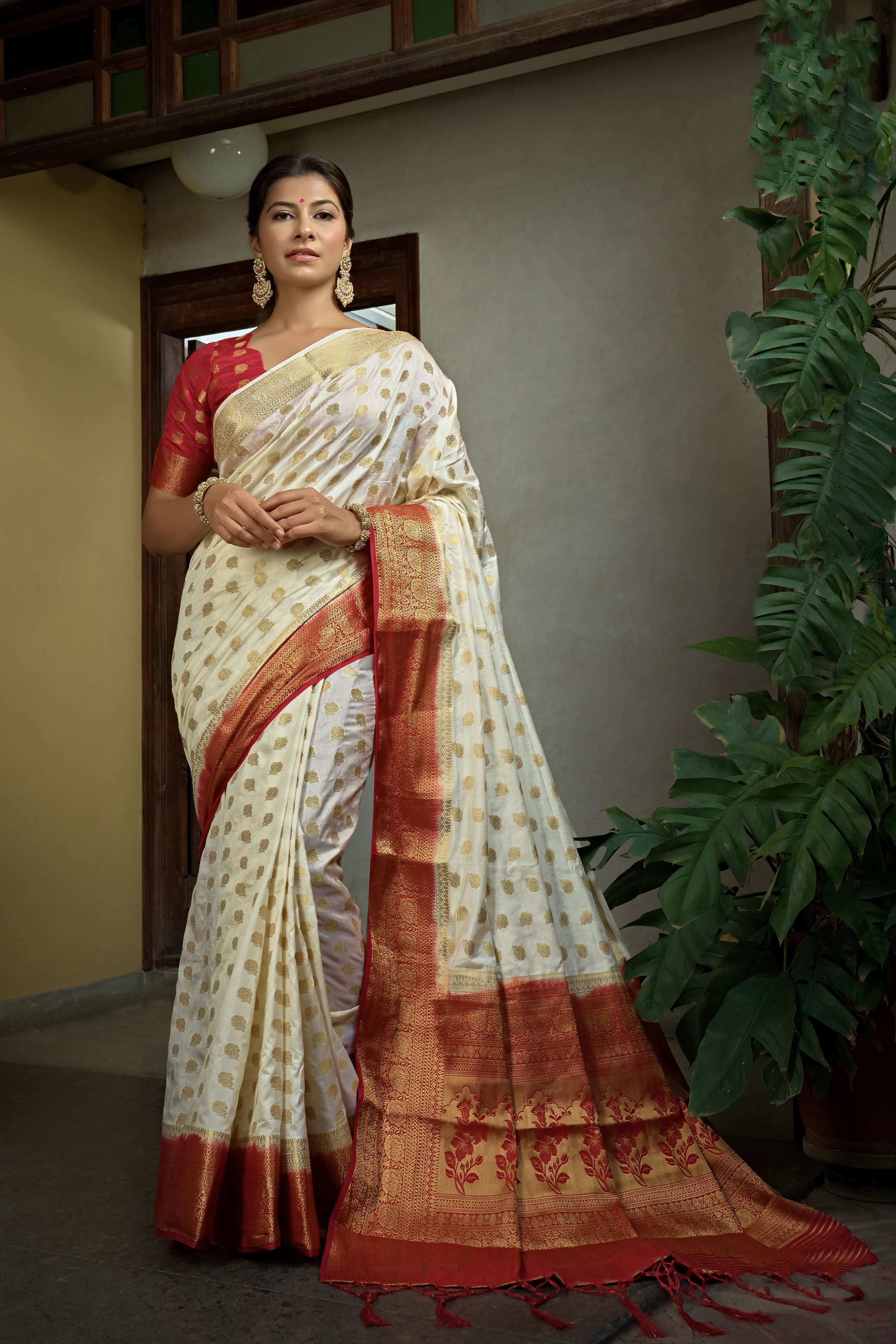 Off White Dola Silk Saree with Maroon Blouse & Golden Zari Weaving Work